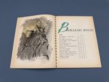 an open book with a drawing of a man riding a horse