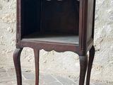 a small wooden table with a drawer on top of it
