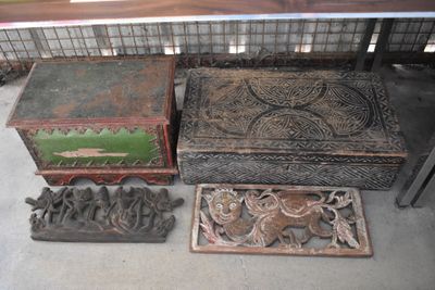 many different types of wooden boxes on the floor