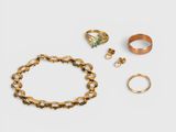 a collection of rings, bracelets and rings on a white surface