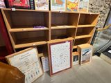 many bookshelves with pictures and pictures on them