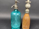 pair of antique blue glass soap dispensers with brass faucet