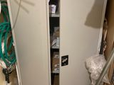 an image of a cabinet in the corner of a room
