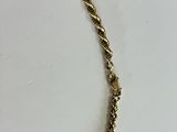yellow gold plated necklace with a twisted rope design and a heart charm