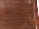 a close up of a wooden table with a white background