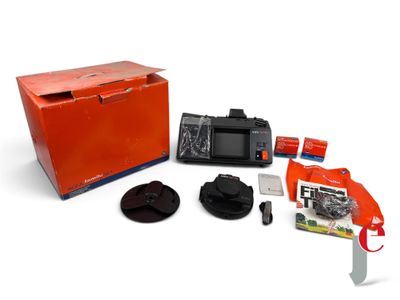 a box with a camera and other items in it