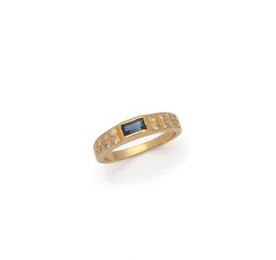 an 18k gold ring with a sapphire and diamonds