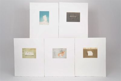 four white cards with gold foil on them are stacked on top of each other