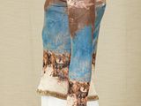 a mannequin with a blue and brown shirt on it