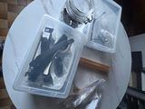 a table with a jar, spoons, and other items on it