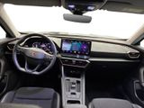 the interior of a car with a steering wheel, dashboard, and a touch screen