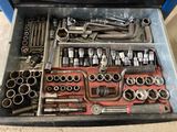 a tool box full of tools that are sitting on the floor