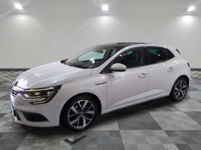 a white car parked in a room with a checkered floor