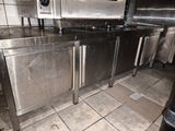 a large stainless steel counter in a commercial kitchen