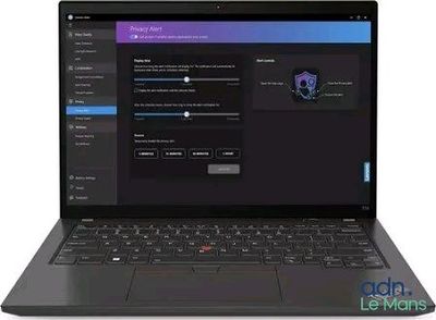 the laptop is open on a white surface with a blue screen