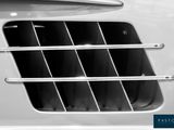 a close up of a car ' s grille with the window open