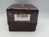an empty box with a barcode on it sitting on a white surface
