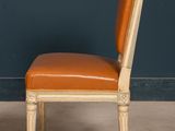 an image of a pair of chairs with leather upholstered seats