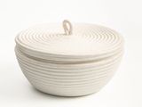 a white bowl with a lid on a white surface