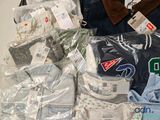 a pile of clothing that is sitting on a table