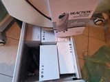 a machine that is sitting on the floor next to a box