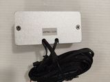 a picture of a white box with a cord attached to it