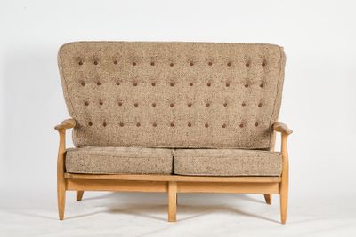 an image of a brown couch sitting on top of a white floor