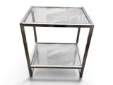 an image of a glass and metal side table on a white background