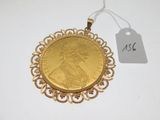 a close up of a gold coin with a price tag on it