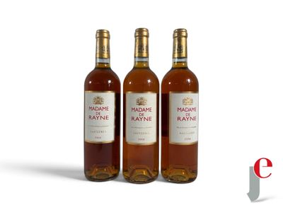 three bottles of wine sitting next to each other on a white surface