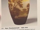 a picture of a vase with a picture of a tree on it