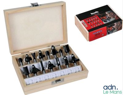 a picture of a set of router bits in a wooden box