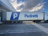 a semi truck that is parked in front of a building