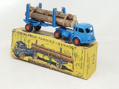 a toy truck with a log on the back of it