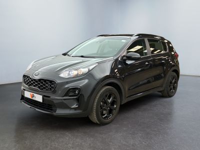 a grey car parked in a room with a black floor