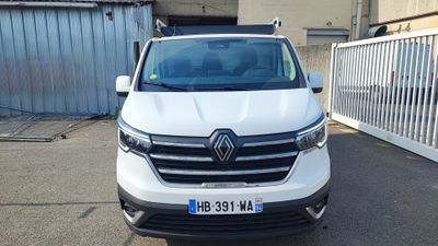 the front view of a white van parked in a parking lot