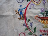 a close up of a piece of embroidery with a man on it