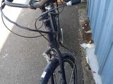 a bicycle that is parked next to a building