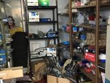 a room filled with lots of items and a refrigerator