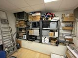 a room with a lot of boxes on the shelves