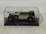 a black and white model of a car in a display case