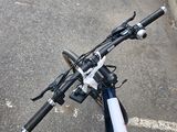 a close up view of a bicycle handlebar on the street