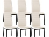 lot de quatre chaises de salle à manger en cuir blanc avec des pieds noirs