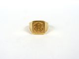 a close up of a gold ring with a snake on it