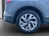 a close up of a car ' s wheel on the ground