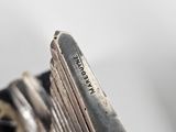 a close up of a motorcycle with a metal handle