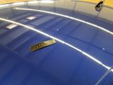a remote control sitting on top of a blue car