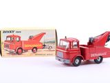 a red toy truck with a crane on the back
