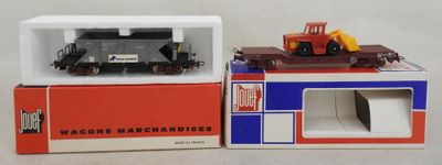 two toy trains that are on display in a box