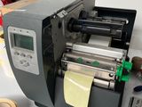 a machine that is sitting on a table with tape
